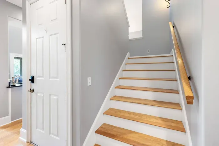 Hardwood stairs up to the loft and the upstairs king suite.
