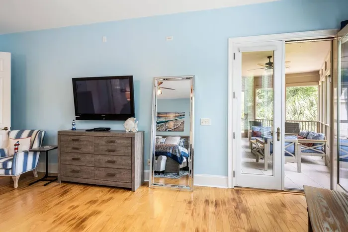 French doors open from the primary straight onto the screened porch. Coffee in your robe, no witnesses.
