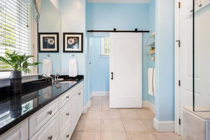 A sliding barn door to the water closet keeps things private.