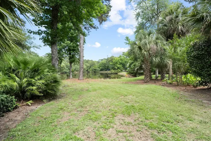 Open lawn running down to the lagoon. Room for a game of anything.