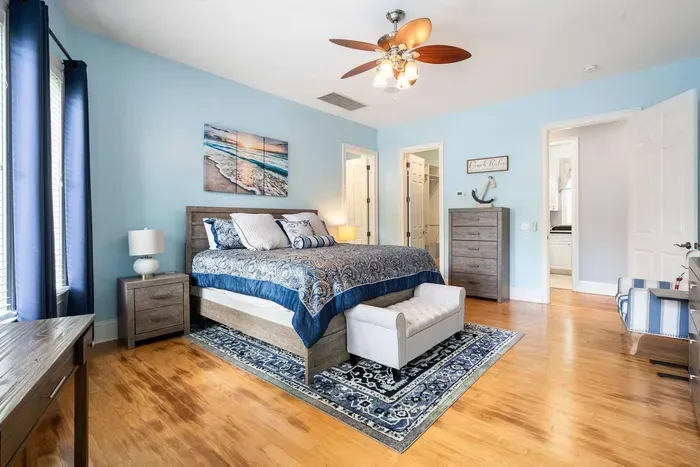 Primary suite with a king bed, walk-in closet, and en suite bath just steps away.