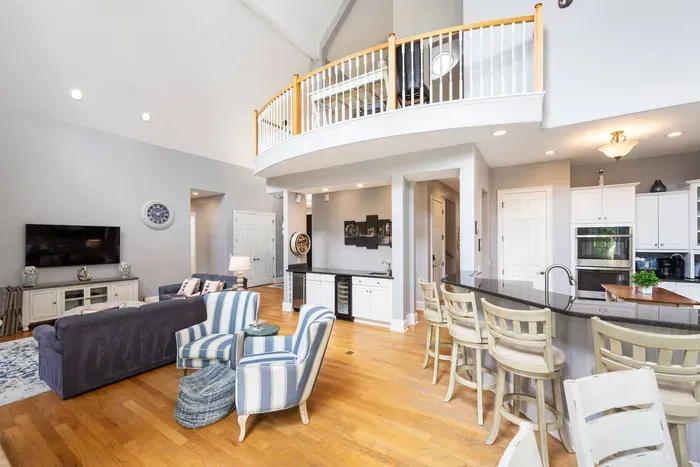 Sightlines from the sofa straight through to the kitchen bar. Nobody misses the conversation.