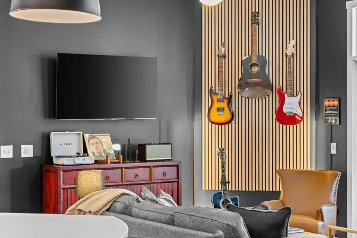Our feature guitar wall is definitely a focal point in the living room.  Put on a vinyl and enjoy some of Cash's tunes.