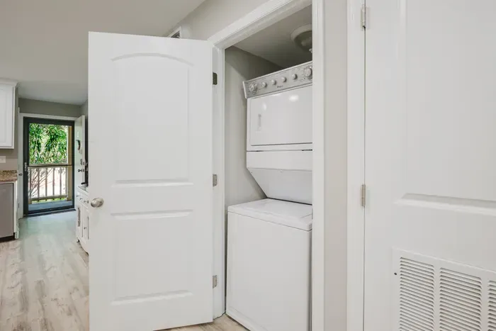 In-unit stacked washer and dryer just off the kitchen. Rinse the sand out midweek and go home with a lighter bag.