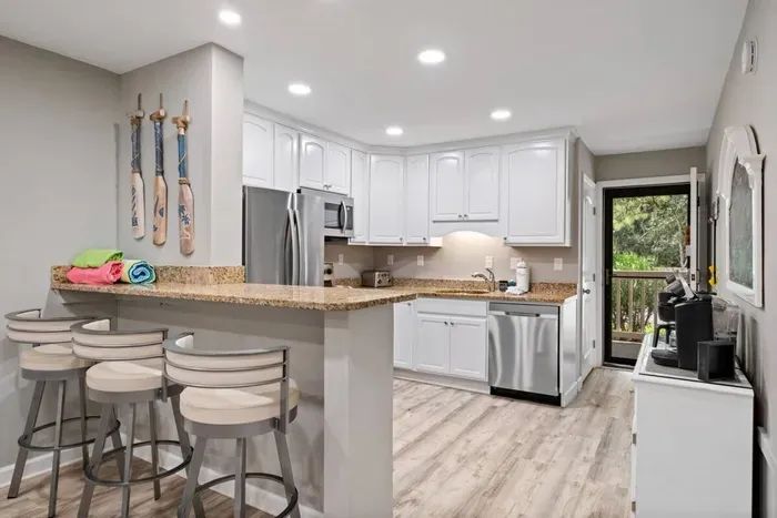 Countertop, serves as a versatile workspace for meal preparation and casual dining.
