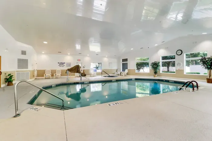 Indoor pool with sauna and hot tub