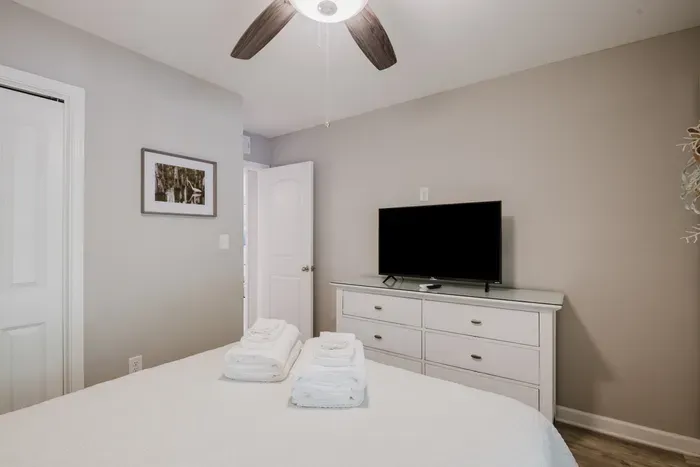 Second bedroom comes with its own smart TV, dresser, and closet.  Guests get real space, not an afterthought.