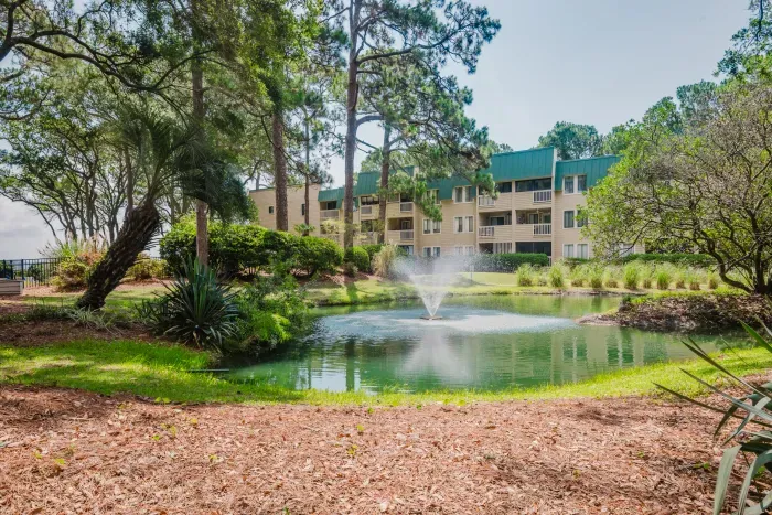 Tranquil pond views with fountain and lush, resort style grounds.