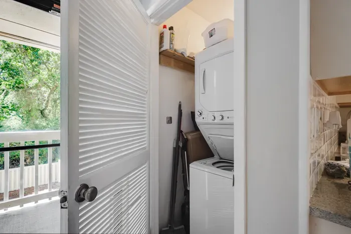 Convenient in-unit washer/dryer with natural light and handy storage