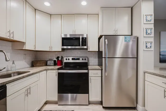 Bright modern kitchen with stainless appliances and ample cabinet space