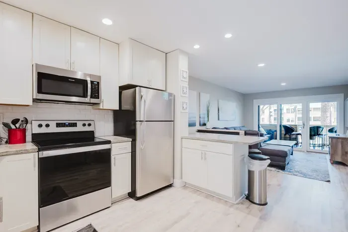 Bright open kitchen and living area with balcony access