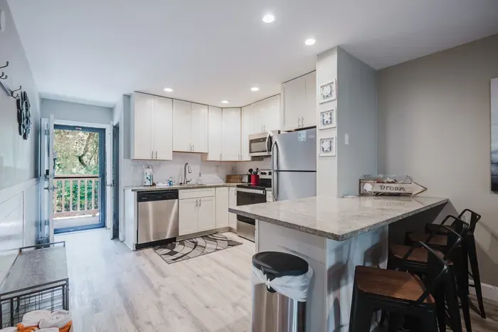 Bright modern kitchen with breakfast bar and easy outdoor access