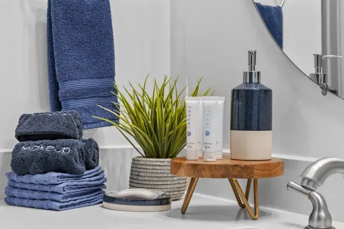 Our bathroom is prepped and ready for your arrival -- plush bath towels, makeup towels, and travel size toiletries in case you leave anything at home. :)