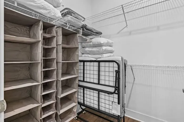 Custom closet organizers, extra pillows, blankets, and sheet sets for the sleeper sofa, and two rollaway beds.