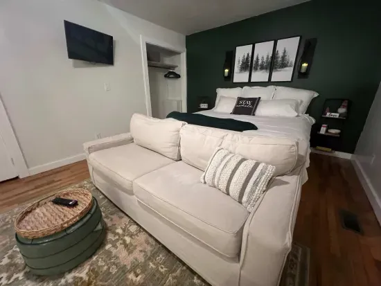 Master king bedroom suite closer view of couch and bed.