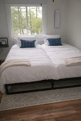 Split king bed in bedroom 3 for couples who need their own mattress but want to share a king frame. An en suite bathroom is attached. 