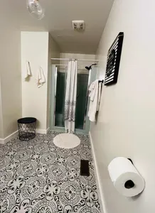 Master-king suite 1 bathroom view from toliet. Custom sink area is to the left, not pictured.