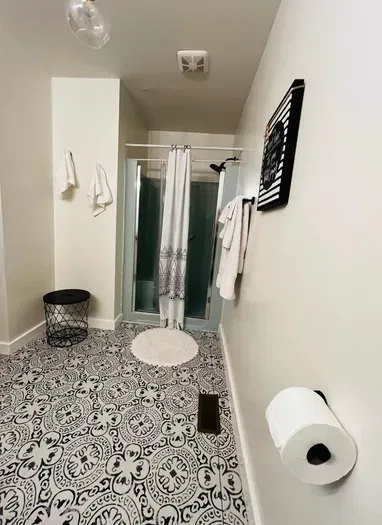 Master-king suite 1 bathroom view from toliet. Custom sink area is to the left, not pictured.