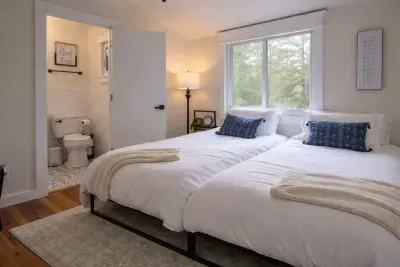Split-king* master bedroom suite is located by the laundry room and is on the opposite side of the house as the other 3 bedrooms for extra privacy. 

*A split-king bed means 2 twin beds are on 1 KING FRAME. .