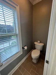 A private toilet room in the master bathroom provides privacy.