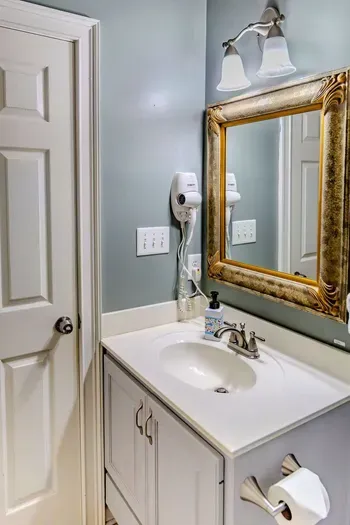 Bathroom entry from bedroom or hallway. It is the second bathroom downstairs besides the master king bathroom. There is a third bathroom upstairs.