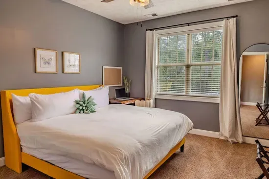 The second king bedroom has a desk and chair, large walk in closet, ceiling fan and a 55' TV (not pictured). 