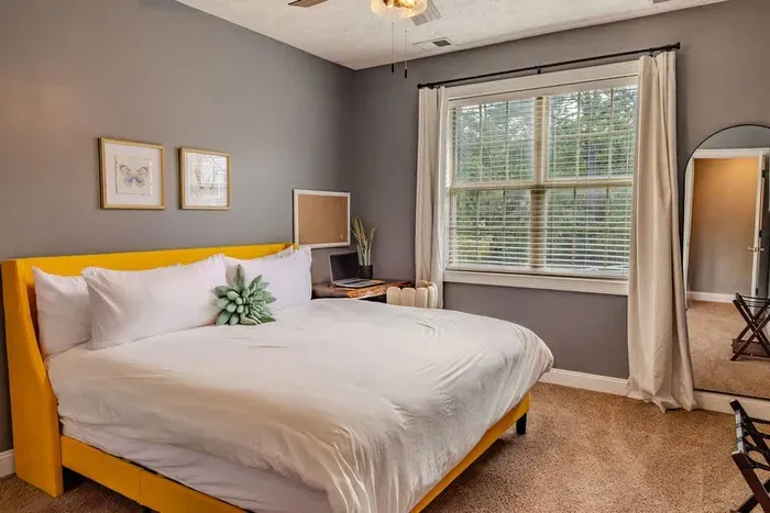 The second king bedroom has a desk and chair, large walk in closet, ceiling fan and a 55' TV (not pictured).