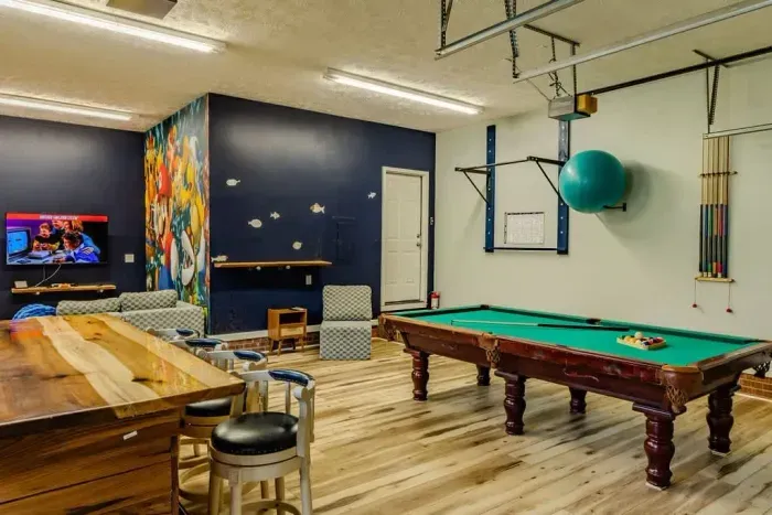 Pull up bar and excercise ball on the wall behind the 9 foot billiards table. You can workout and play in this room!