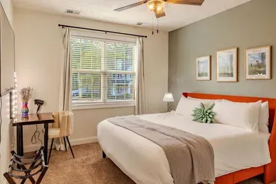 You'll love getting ready at this custom slab vanity and sleeping in the comfortable king bed.