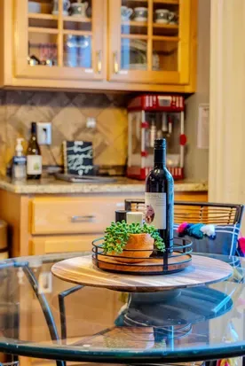 Popcorn machine for movie theater popcorn right at home! View from kitchen nook table that looks out at pool and at Labrador Lake. 