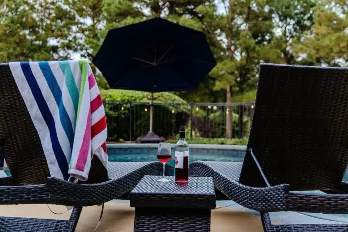 You'll love relaxing by the pool as you view Labrador Lake.