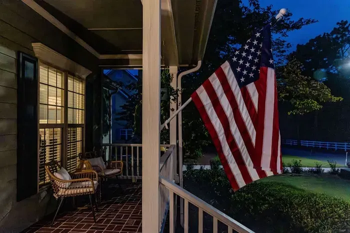 Fort Bragg is 25-30 minutes away! We love our Troops and they are our #1 guests. We feel honored to house them in our community. A welcoming front porch features modern wicker chairs in a cozy nook with bohol cushions, perfect for relaxing.