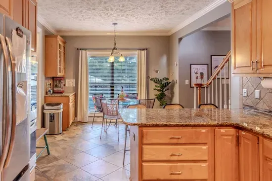 Breakfast nook accommodates seating for four so you can enjoy the view of children playing by the pool. 
