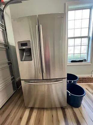 Second fridge located by the bar in the garage next to the kitchen for accommodating large groups of people.