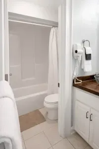 Upstairs bathroom has a separate room for toliet and shower. Perfect for larger groups who may need the dual sink area in bathroom.