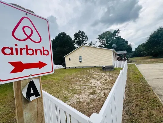 Large fenced in side and back yard area. A large unfenced yard is on the opposite side of house for kids to play as well as a relaxing firepit and grill area for families. 