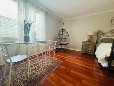 Couple's dining area in master bedroom can also serve as a desk.