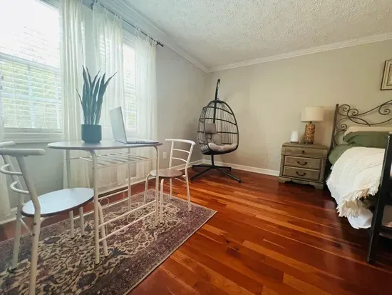Couple's dining area in master bedroom can also serve as a desk. 