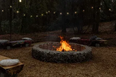 This BONFIRE area belongs to Sandhills Mushroom Farm (SMF) on the back side of the 3-acre property. Registered guests ONLY may use it for FREE as well as the hiking trail and picnic area when it's not being used by SMF.