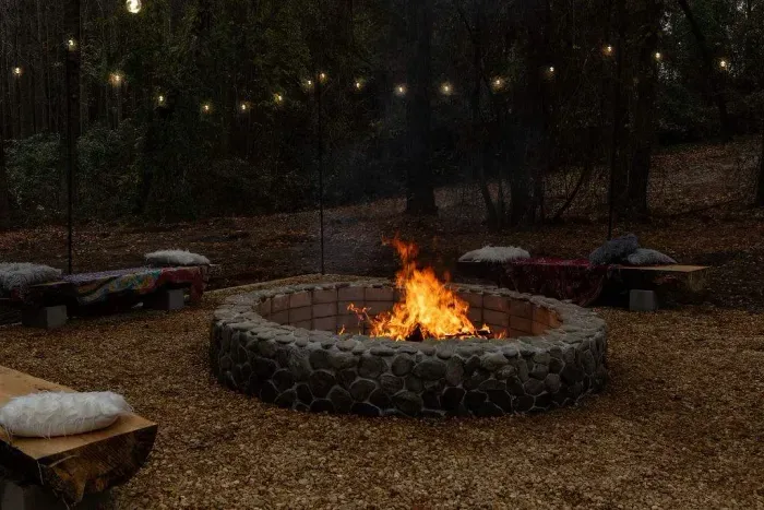 This BONFIRE area belongs to Sandhills Mushroom Farm (SMF) on the back side of the 3-acre property. Registered guests ONLY may use it for FREE as well as the hiking trail and picnic area when it's not being used by SMF.