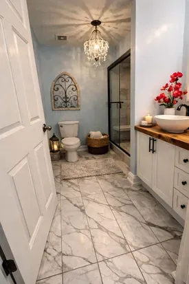 Elegant and serene, the main bathroom features calming décor and a spacious tiled walk-in shower with a built-in bench.