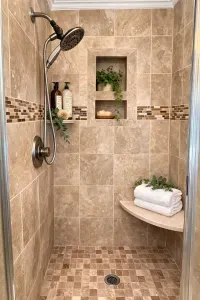 The master bathroom features a spacious tiled walk-in shower complete with a built-in bench. There is a separate oversized tub in bathroom as well.