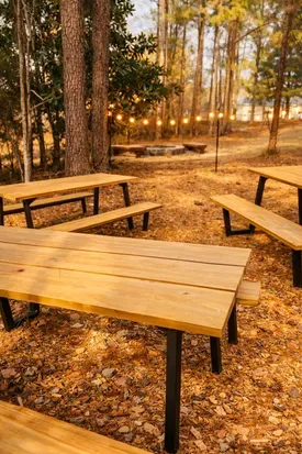 View from picnic area of bonfire area and house in the distance. Registered guests may enjoy use of the nearby private area nearby during their stay when it’s not being commercially used. 