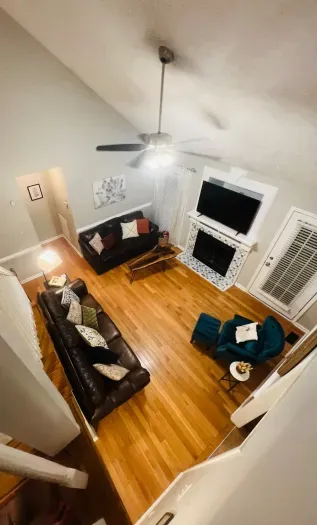 Living room from top of stairs looking down. Picture taken Nov 2025.