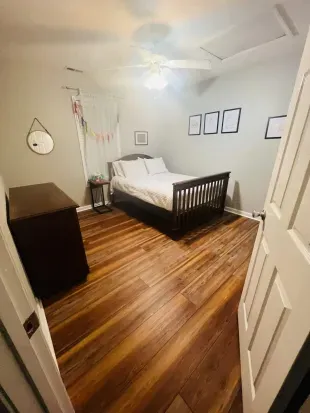 Double bed in bedroom view from door. 