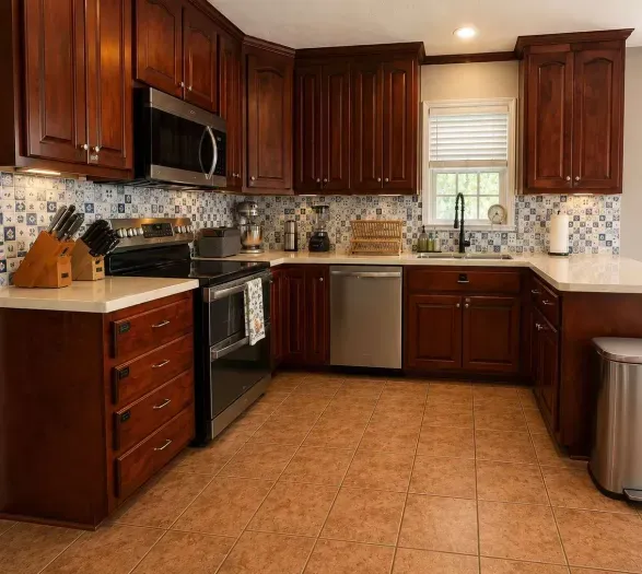 You'll enjoy the large kitchen area with lots of counter space. Two bar stools not pictured. Kitchen nook is to right - perfect for family gatherings so you can cook and converse with your family.