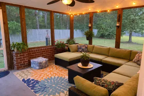 You will feel a sense of peace on the back porch as you view pine trees beyond the fenced yard. 