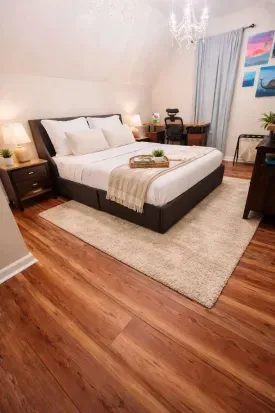 This is the 2nd king bedroom. There is a TV & desk area/work station in this spacious bedroom. There are four drawers for clothes under the bed that pull out.

*Rug removed since pictured. LVP floor.