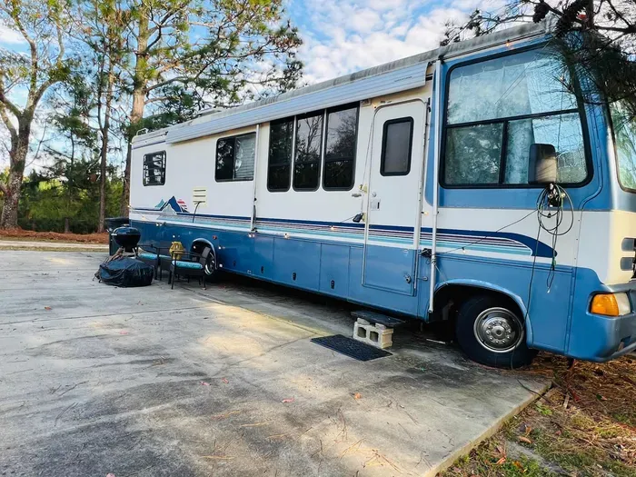 RV is parked behind an AirBnB rental house. It's peaceful and you can see the stars at night. Just outside town and base. You won't find anything closer to base at this value- or we will match it.
