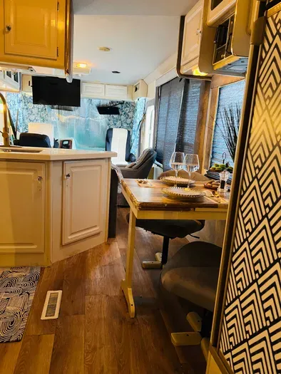 View from bedroom towards living room. The fridge is to the right.